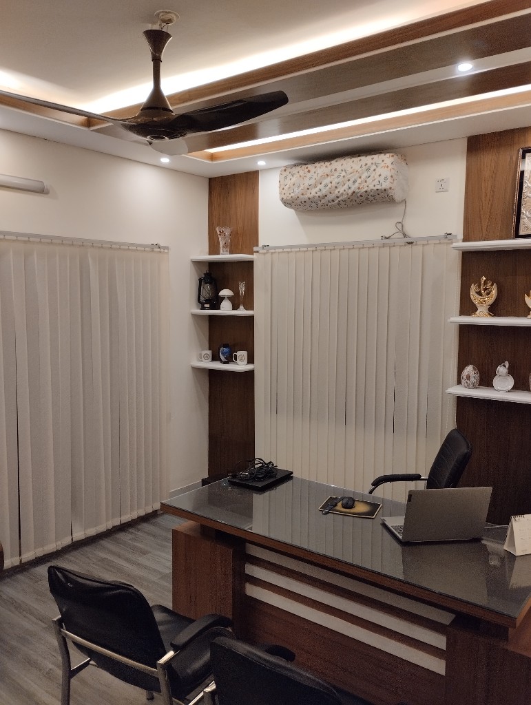 Doctor’s office shelving with decor and blinds