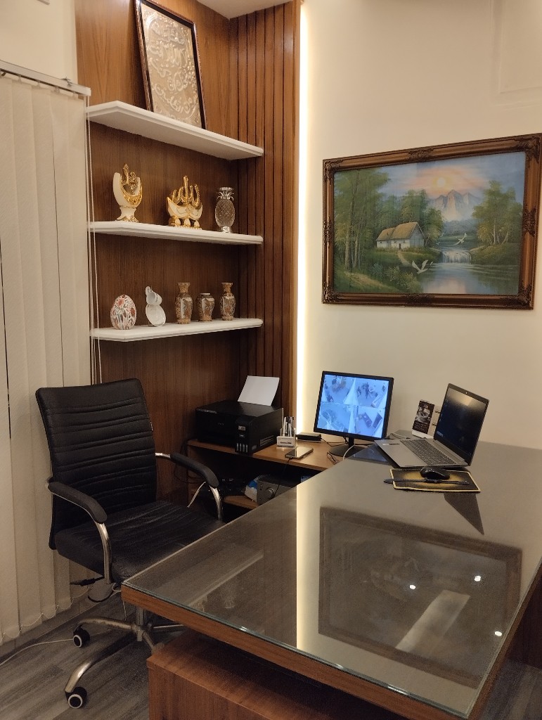 Doctor at desk in office at Rosebud Dental